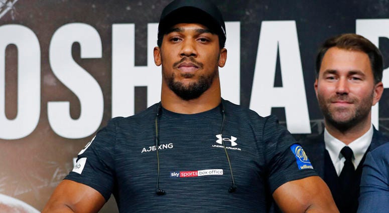 boxer Anthony Joshua, of Britain, foreground, poses with boxing promoter Eddie Hearn after a press conference for Joshua's fight against Russia's Alexander Povetkin AP DO NOT USE