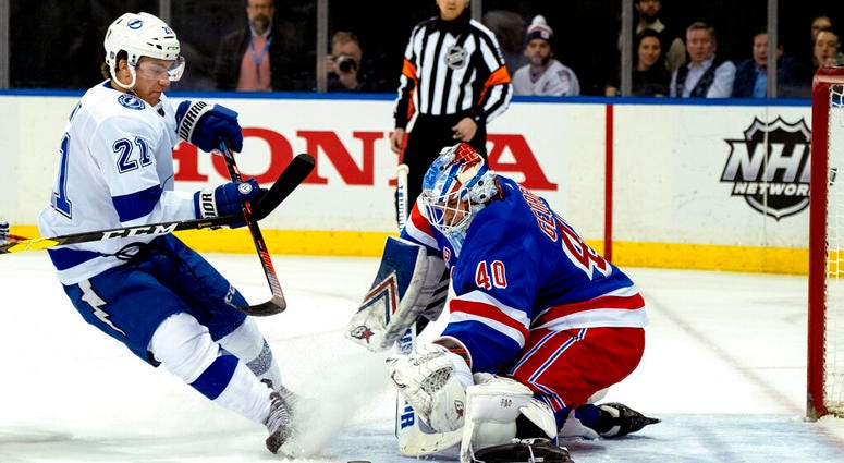 New York Rangers goalie Alexander Georgiev blocks a shot by Tampa Bay Lightning's Brayden Point during the first period of an NHL hockey game AP DO NOT USE