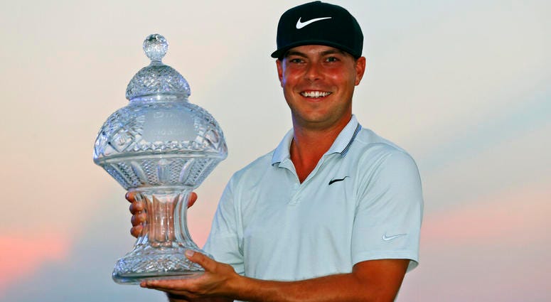 Keith Mitchell holds up his trophy after winning the Honda Classic golf tournament Sunday, March 3, 2019, in Palm Beach Gardens, Fla. Keith Mitchell holds up his trophy after winning the Honda Classic golf tournament Sunday, March 3, 2019, in Palm Beach Gardens, Fla.
