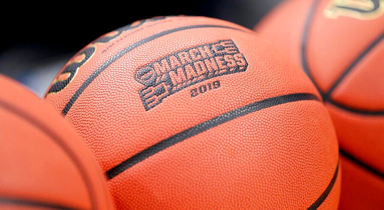 A basketball with March Madness 2019 sits in a rack before Michigan practice at the NCAA college basketball tournament in Des Moines, Iowa, Wednesday, March 20, 2019. AP DO NOT USE