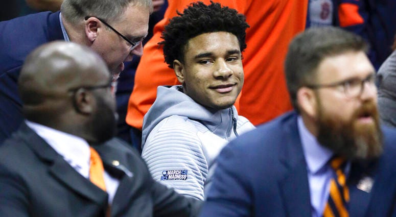 Injured Auburn forward Chuma Okeke is positioned behind the Auburn bench in a wheelchair during the second half of the Midwest Regional final game against Kentucky AP DO NOT USE