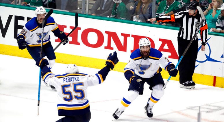 St. Louis Blues' Tyler Bozak (21), Colton Parayko (55) and Pat Maroon (7) celebrate a goal by Maroon against the Dallas Stars in the third period of Game 3 of an NHL second-round hockey playoff series in Dallas, Monday, April 29, 2019. AP DO NOT USE