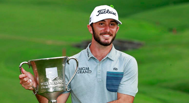 Max Homa poses with the trophy after winning the Wells Fargo Championship golf tournament at Quail Hollow Club in Charlotte, N.C., Sunday, May 5, 2019. Max Homa poses with the trophy after winning the Wells Fargo Championship golf tournament at Quail Hollow Club in Charlotte, N.C., Sunday, May 5, 2019.