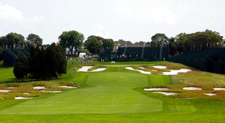In this June 12, 2009, file photo, Bunkers line the fairway and protect the green on the 18th hole of Bethpage State Park's Black Course in Farmingdale, N.Y. AP DO NOT USE`