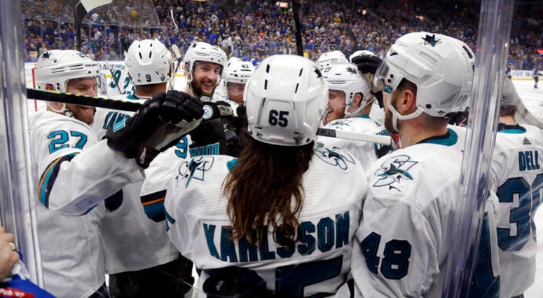 San Jose Sharks defenseman Erik Karlsson (65), of Sweden, is congratulated after scoring the winning goal against the St. Louis Blues during overtime in Game 3 of the NHL hockey Stanley Cup Western Conference final series Wednesday, May 15, 2019, in St. L AP DO NOT USE