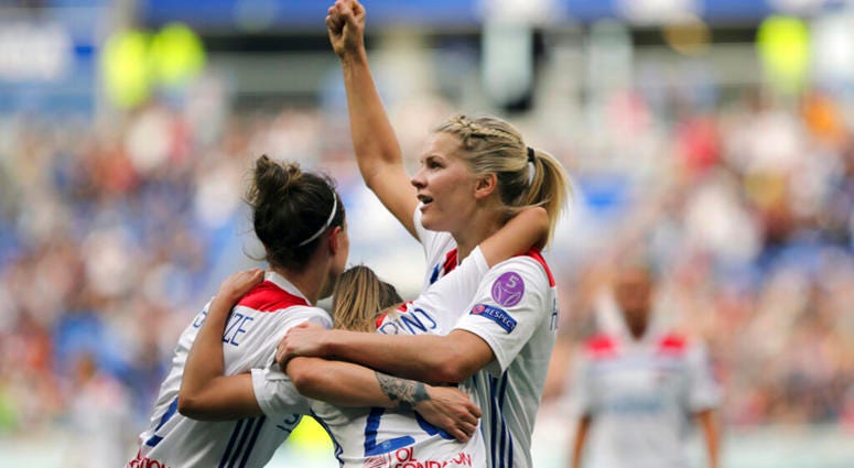 In this Sunday, April 21, 2019 file photo, Lyon's Delphine Cascarino, center, celebrates with Ada Hegerberg, right, and Lucy Bronze after scoring against Chelsea during the Women's Champions League semifinal soccer match in Decines, France AP DO NOT USE