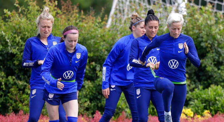 US player Megan Rapinoe, front right, stretches with Ali Krieger and other team members during a US womens soccer team training session at the Tottenham Hotspur training centre in London, Thursday, June 6, 2019. The Women's World Cup starts in France on J US player Megan Rapinoe, front right, stretches with Ali Krieger and other team members during a US womens soccer team training session at the Tottenham Hotspur training centre in London, Thursday, June 6, 2019. The Women's World Cup starts in France on J