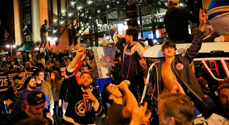 St. Louis Blues fans celebrate outside Busch Stadium in St. Louis, where a watch party had been held for Game 7 of the NHL hockey Stanley Cup Final between the Blues and the Boston Bruins in Boston, Wednesday, June 12, 2019. The Blues won the title. St. Louis Blues fans celebrate outside Busch Stadium in St. Louis, where a watch party had been held for Game 7 of the NHL hockey Stanley Cup Final between the Blues and the Boston Bruins in Boston, Wednesday, June 12, 2019. The Blues won the title.