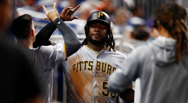 Pittsburgh Pirates' Josh Bell (55) celebrates in the dugout after scoring during the fifth inning of a baseball game against the Miami Marlins, Friday, June 14, 2019, in Miami. Pittsburgh Pirates' Josh Bell (55) celebrates in the dugout after scoring during the fifth inning of a baseball game against the Miami Marlins, Friday, June 14, 2019, in Miami.