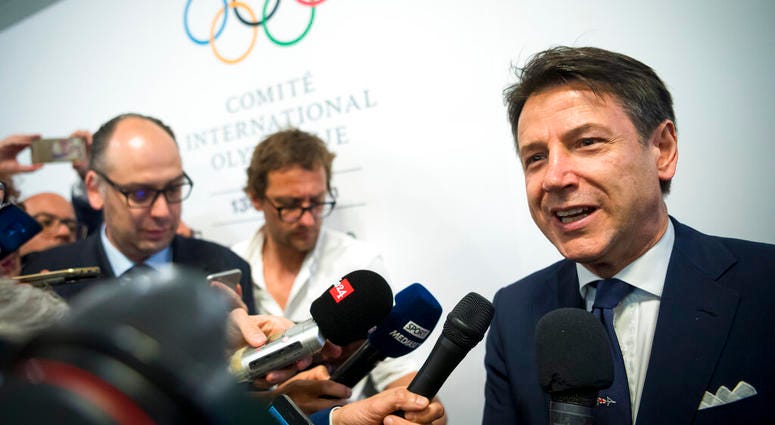 Italian Prime minister Giuseppe Conte speaks to journalists as he arrives during the first day of the 134th Session of the International Olympic Committee Italian Prime minister Giuseppe Conte speaks to journalists as he arrives during the first day of the 134th Session of the International Olympic Committee