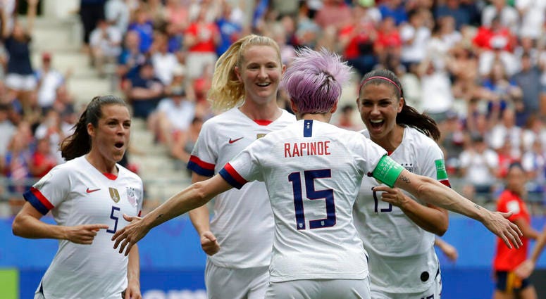United States' Megan Rapinoe, front, celebrates with teammates after scoring the opening goal from a penalty kick during the Women's World Cup round of 16 soccer match between Spain and US at the Stade Auguste-Delaune in Reims, France, Monday, June 24, 20 United States' Megan Rapinoe, front, celebrates with teammates after scoring the opening goal from a penalty kick during the Women's World Cup round of 16 soccer match between Spain and US at the Stade Auguste-Delaune in Reims, France, Monday, June 24, 20