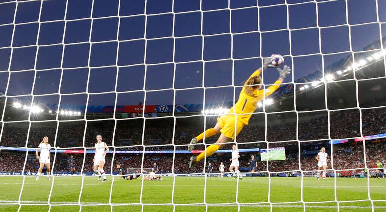 United States goalkeeper Alyssa Naeher is airborne as she makes a save during the Women's World Cup quarterfinal soccer match between France and the United States at Parc des Princes in Paris, France, Friday, June 28, 2019. United States goalkeeper Alyssa Naeher is airborne as she makes a save during the Women's World Cup quarterfinal soccer match between France and the United States at Parc des Princes in Paris, France, Friday, June 28, 2019.