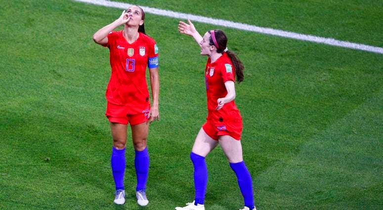 United States' Alex Morgan, left, celebrates her side's second goal during the Women's World Cup semifinal soccer match between England and the United States, at the Stade de Lyon outside Lyon, France, Tuesday, July 2, 2019.