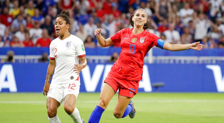 United States' Alex Morgan, right, celebrates after scoring her side's second goal next to England's Demi Stokes during the Women's World Cup semifinal soccer match between England and the United States, at the Stade de Lyon, outside Lyon, France, Tuesday