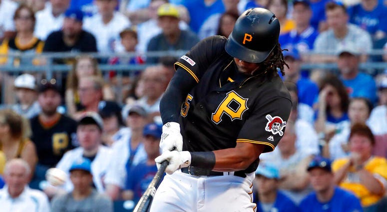 FILE - In this July 1, 2019, file photo, Pittsburgh Pirates' Josh Bell hits a three-run home run off Chicago Cubs starting pitcher Adbert Alzolay during the first inning of a baseball game in Pittsburgh.
