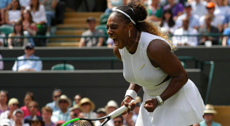 United States' Serena Williams celebrates winning a point against Spain's Carla Suarez Navarro in a women's singles match during day seven of the Wimbledon Tennis Championships in London, Monday, July 8, 2019. AP DO NOT USE