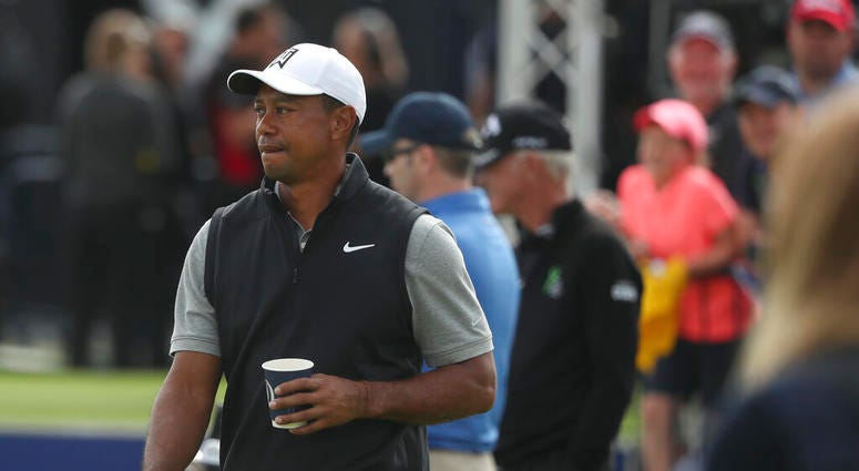Tiger Woods of the United States holds a drink as he walks through the practice range ahead of the start of the British Open golf championships at Royal Portrush in Northern Ireland, Tuesday, July 16, 2019. The British Open starts Thursday. Tiger Woods of the United States holds a drink as he walks through the practice range ahead of the start of the British Open golf championships at Royal Portrush in Northern Ireland, Tuesday, July 16, 2019. The British Open starts Thursday.
