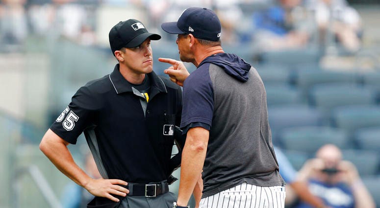 New York Yankees' manager Aaron Boone yells at home plate umpire Brennan Miller during the second inning of the first game of a baseball doubleheader against the Tampa Bay Rays' Thursday, July 18, 2019, in New York. New York Yankees' manager Aaron Boone yells at home plate umpire Brennan Miller during the second inning of the first game of a baseball doubleheader against the Tampa Bay Rays' Thursday, July 18, 2019, in New York.