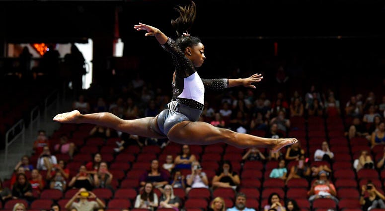 Simone Biles performs her balance beam routine during the GK US Classic gymnastics meet in Louisville, Ky., Saturday, July 20, 2019. Simone Biles performs her balance beam routine during the GK US Classic gymnastics meet in Louisville, Ky., Saturday, July 20, 2019.