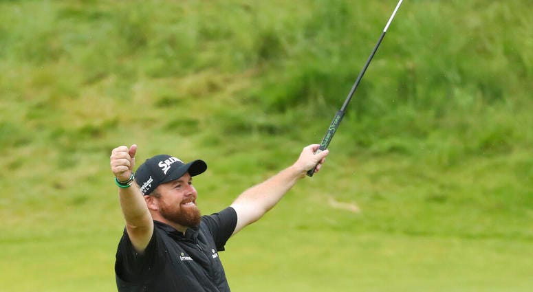 Ireland's Shane Lowry lifts his club to celebrate as he wins the British Open Golf Championships at Royal Portrush in Northern Ireland, Sunday, July 21, 2019. Ireland's Shane Lowry lifts his club to celebrate as he wins the British Open Golf Championships at Royal Portrush in Northern Ireland, Sunday, July 21, 2019.