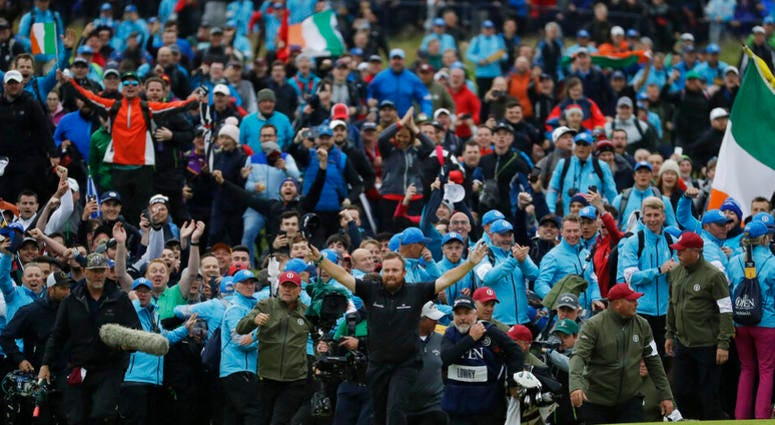 Ireland's Shane Lowry walks arms outstretched on the 18th green as he goes on to win the British Open Golf Championships at Royal Portrush in Northern Ireland, Sunday, July 21, 2019. Ireland's Shane Lowry walks arms outstretched on the 18th green as he goes on to win the British Open Golf Championships at Royal Portrush in Northern Ireland, Sunday, July 21, 2019.