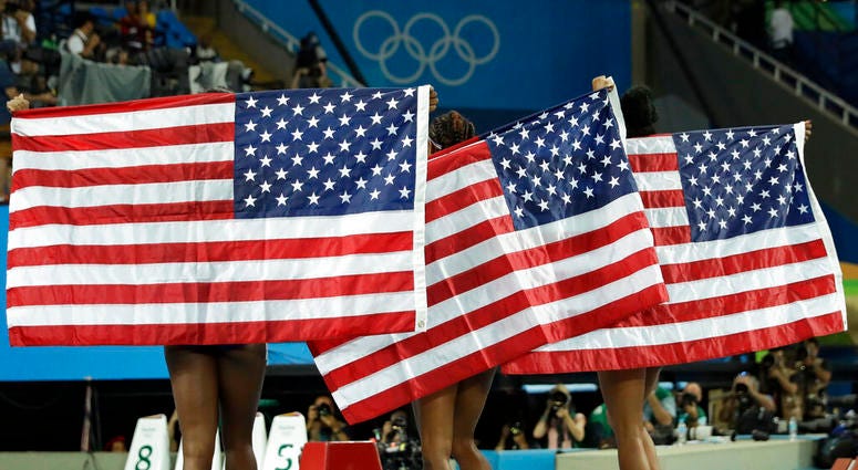 gold medal winner Brianna Rollins, center, silver medal winner Nia Ali, left, and bronze medal winner Kristi Castlin, all from the United States gold medal winner Brianna Rollins, center, silver medal winner Nia Ali, left, and bronze medal winner Kristi Castlin, all from the United States