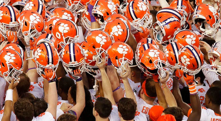 FILE - In this Jan. 7, 2019, file photo, Clemson players huddle before the NCAA college football playoff championship game against Alabama, in Santa Clara, Calif. For the first time, the defending national champion Tigers are No. 1 in The Associated Press
