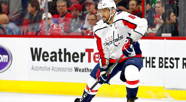 In this April 18, 2019, file photo, Washington Capitals' Alex Ovechkin (8) works the puck against the Carolina Hurricanes during the first period of Game 4 of an NHL hockey first-round playoff series, in Raleigh, N.C. AP DO NOT USE