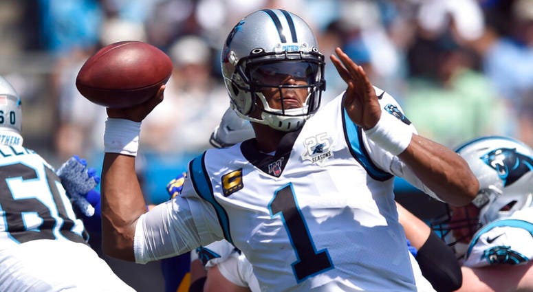 Carolina Panthers quarterback Cam Newton (1) looks to pass against the Los Angeles Rams during the first half an NFL football game in Charlotte, N.C., Sunday, Sept. 8, 2019. AP DO NOT USE
