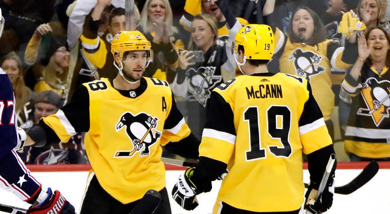 Pittsburgh Penguins' Kris Letang (58) celebrates his goal with Jared McCann during the second period of an NHL hockey game against the Columbus Blue Jackets in Pittsburgh, Saturday, Oct. 5, 2019. Pittsburgh Penguins' Kris Letang (58) celebrates his goal with Jared McCann during the second period of an NHL hockey game against the Columbus Blue Jackets in Pittsburgh, Saturday, Oct. 5, 2019.