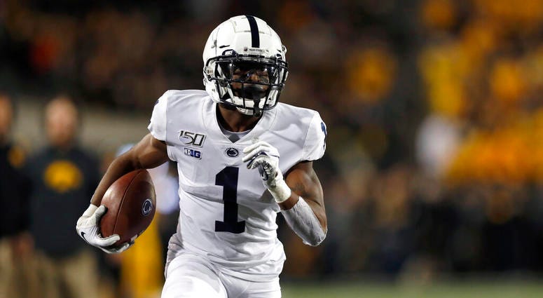 Penn State wide receiver KJ Hamler runs the ball in for a touchdown during the first half of the team's NCAA college football game against Iowa on Saturday, Oct. 12, 2019, in Iowa City, Iowa. Penn State wide receiver KJ Hamler runs the ball in for a touchdown during the first half of the team's NCAA college football game against Iowa on Saturday, Oct. 12, 2019, in Iowa City, Iowa.
