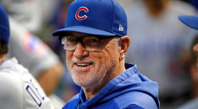 In this Sept. 25, 2019, file photo, then-Chicago Cubs manager Joe Maddon stands in the dugout before a baseball game against the Pittsburgh Pirates, in Pittsburgh.