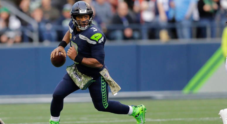 Seattle Seahawks quarterback Russell Wilson scrambles against the Tampa Bay Buccaneers during the second half of an NFL football game, Sunday, Nov. 3, 2019, in Seattle. AP DO NOT USE