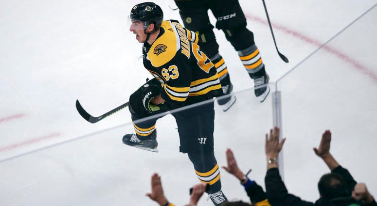 Boston Bruins center Brad Marchand celebrates after his winning goal off Pittsburgh Penguins goaltender Tristan Jarry during the third period of an NHL hockey game in Boston, Monday, Nov. 4, 2019. AP DO TNO USE