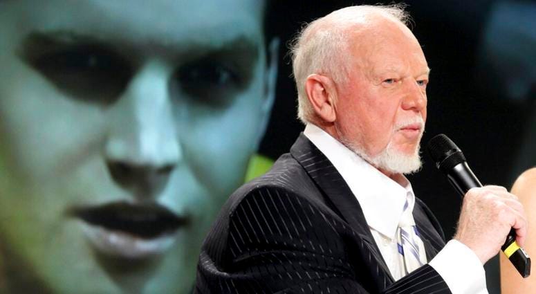 In this March 24, 2010, file photo, hockey personality Don Cherry, right, speaks during a news conference as actor Jared Keeso is displayed on a video screen while playing Cherry in the bio film "Keep Your Head Up Kid: The Don Cherry Story" in Toronto AP DO NOT USE