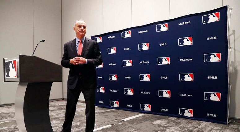Baseball commissioner Rob Manfred steps away from the podium after speaking to the media at the owners meeting in Arlington, Texas, Thursday, Nov. 21, 2019. Baseball commissioner Rob Manfred steps away from the podium after speaking to the media at the owners meeting in Arlington, Texas, Thursday, Nov. 21, 2019.