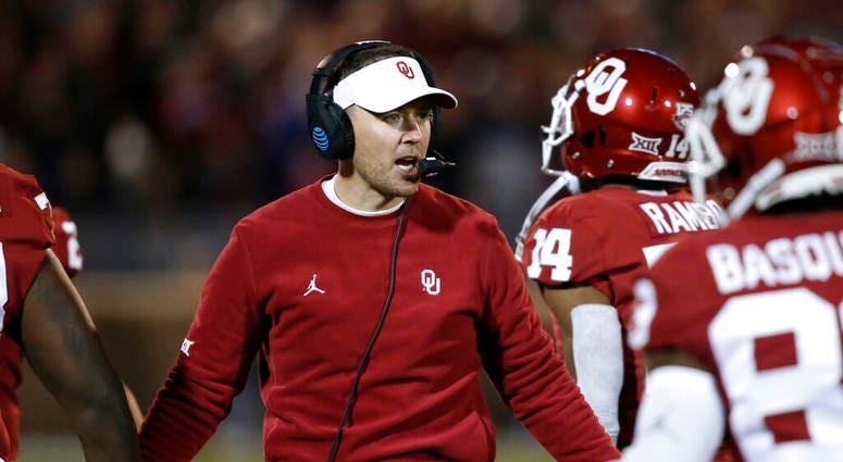 Oklahoma head coach Lincoln Riley greets players as they return to the sideline after scoring in the first half of an NCAA college football game against TCU in Norman, Okla., Saturday, Nov. 23, 2019. Oklahoma head coach Lincoln Riley greets players as they return to the sideline after scoring in the first half of an NCAA college football game against TCU in Norman, Okla., Saturday, Nov. 23, 2019.