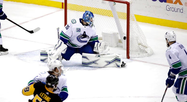 Pens beat Canucks