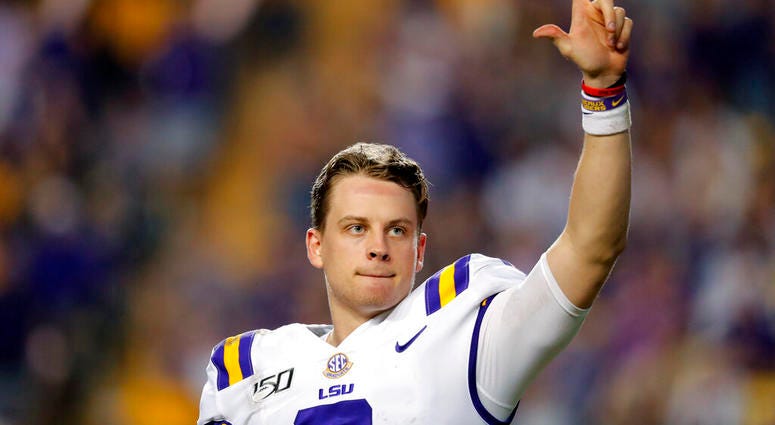 LSU quarterback Joe Burrow, who is considered a frontrunner for the Heisman Trophy, acknowledges the crowd as he is pulled from his last game in Tiger Stadium, in the fourth quarter of the team's NCAA college football matchup against Texas A&M in Baton Ro LSU quarterback Joe Burrow, who is considered a frontrunner for the Heisman Trophy, acknowledges the crowd as he is pulled from his last game in Tiger Stadium, in the fourth quarter of the team's NCAA college football matchup against Texas A&M in Baton Ro