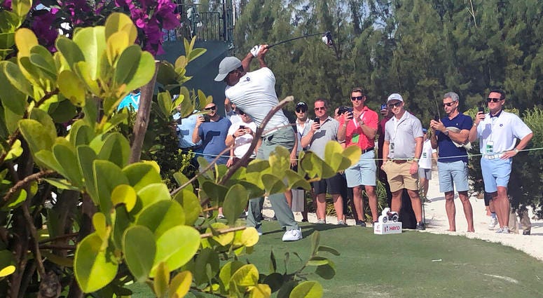 Tiger Woods hits on the par-5 11th hole on his way to an eagle at Albany Golf Club during the second round of the Hero World Challenge in Nassau, Bahamas, Thursday Dec. 5 2019. Woods shot 66. Tiger Woods hits on the par-5 11th hole on his way to an eagle at Albany Golf Club during the second round of the Hero World Challenge in Nassau, Bahamas, Thursday Dec. 5 2019. Woods shot 66.