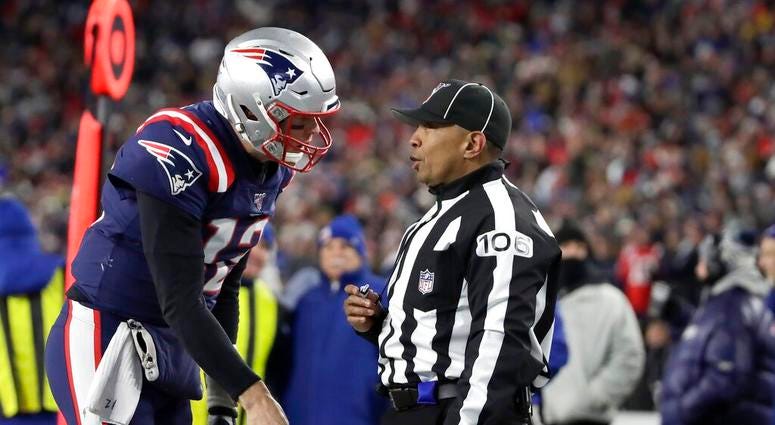 New England Patriots quarterback Tom Brady appeals to down judge Patrick Holt that wide receiver N'Keal Harry had scored a touchdown in the second half of an NFL football game against the Kansas City Chiefs, Sunday, Dec. 8, 2019, in Foxborough, Mass. Harr New England Patriots quarterback Tom Brady appeals to down judge Patrick Holt that wide receiver N'Keal Harry had scored a touchdown in the second half of an NFL football game against the Kansas City Chiefs, Sunday, Dec. 8, 2019, in Foxborough, Mass. Harr