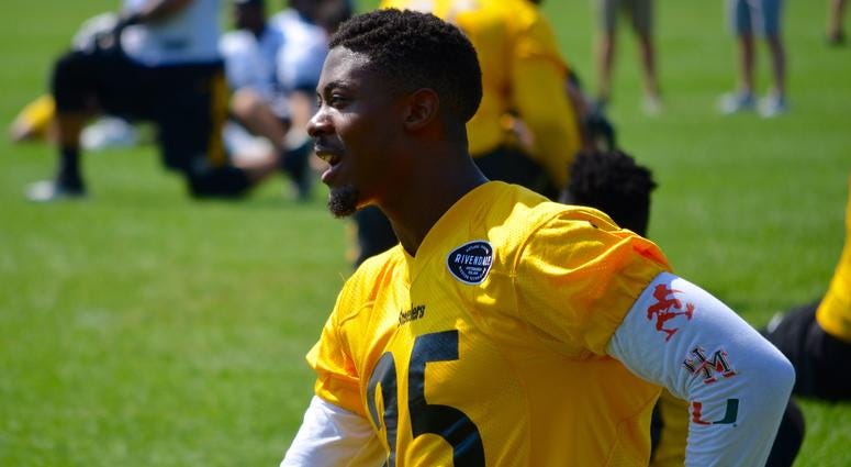 Steelers CB Artie Burns stretches during the team's OTA