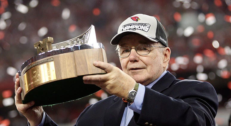 Bill Bidwill of the Arizona Cardinals holds up the George S. Halas trophy after winning the NFC championship game against the Philadelphia Eagles