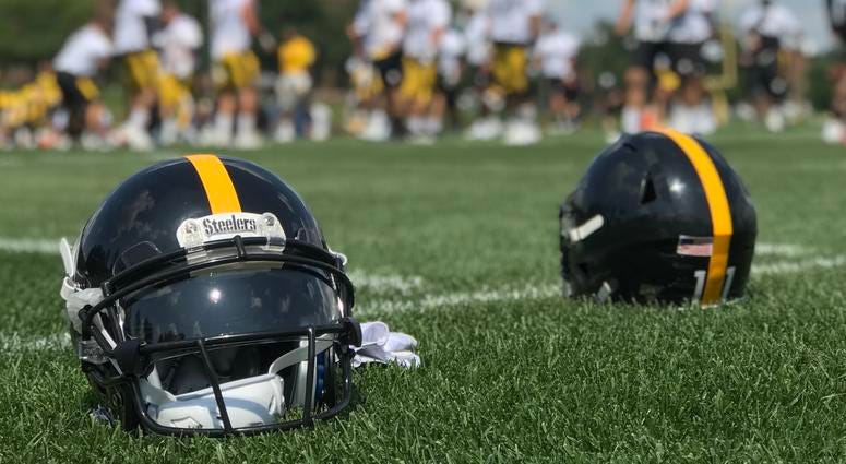 Steelers helmets on the field at Saint Vincent College in 2019 training camp