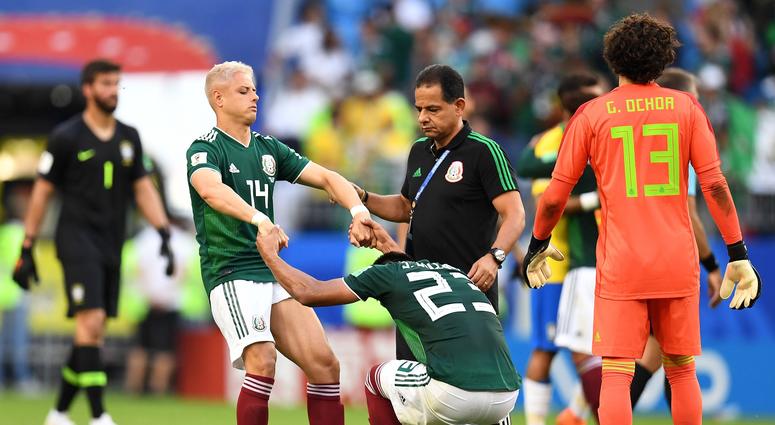 Mexico forward Javier Hernandez (14) and Mexico midfielder Jesus Gallardo (23) react after losing to Brazil in the round of 16 during the FIFA World Cup World Cup
