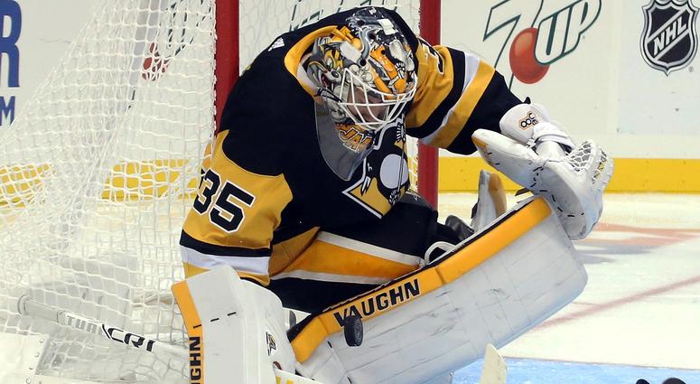 goaltender Tristan Jarry (35) makes a save against the Detroit Red Wings during the third period at PPG PAINTS Arena.