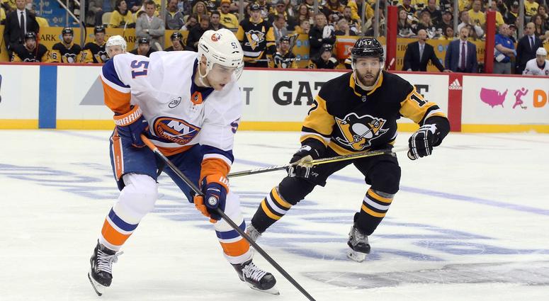 Pittsburgh, PA, USA; New York Islanders center Valtteri Filppula (51) skates with the puck ahead of Pittsburgh Penguins right wing Bryan Rust