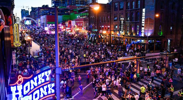 Fans gather on Lower Broadway during the NFL Draft Experience Friday, April 26, 2019, in Nashville, Tenn.