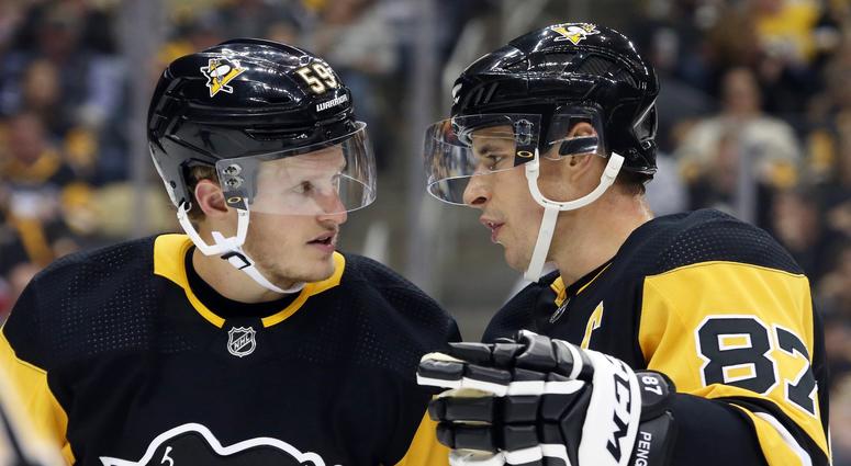 Pittsburgh Penguins center Jake Guentzel and center Sidney Crosby talk before a power play Pittsburgh Penguins center Jake Guentzel and center Sidney Crosby talk before a power play