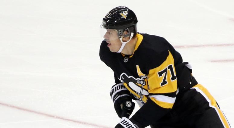 Pittsburgh Penguins center Evgeni Malkin skates with the puck against the Buffalo Sabres Pittsburgh Penguins center Evgeni Malkin skates with the puck against the Buffalo Sabres